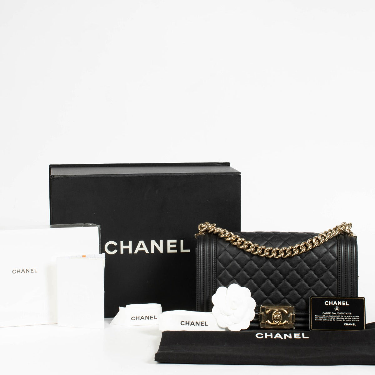 Authentic pre-loved Chanel Black Lambskin Medium Boy Shoulder Bag on Labellov.com