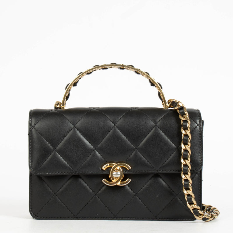 Authentic pre-loved Chanel Black Calfskin Mini Top Handle Flap Bag on Labellov.com