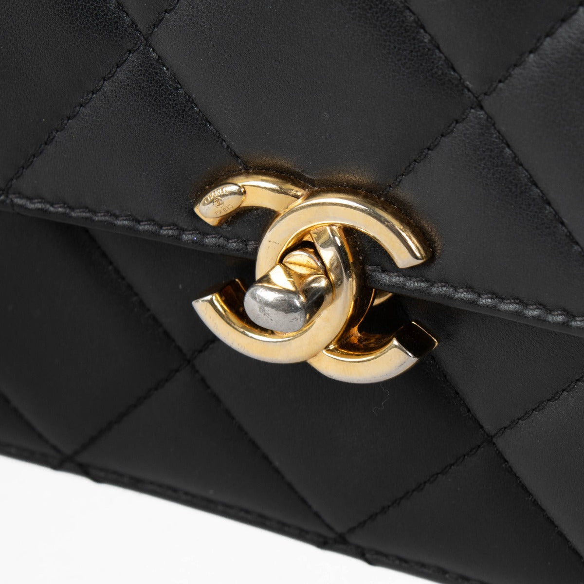Authentic pre-loved Chanel Black Calfskin Mini Top Handle Flap Bag on Labellov.com