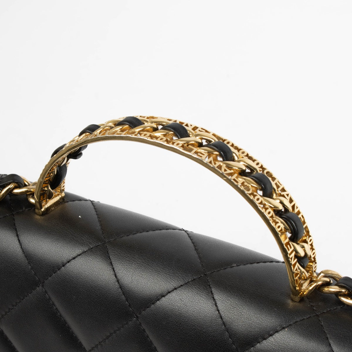 Authentic pre-loved Chanel Black Calfskin Mini Top Handle Flap Bag on Labellov.com