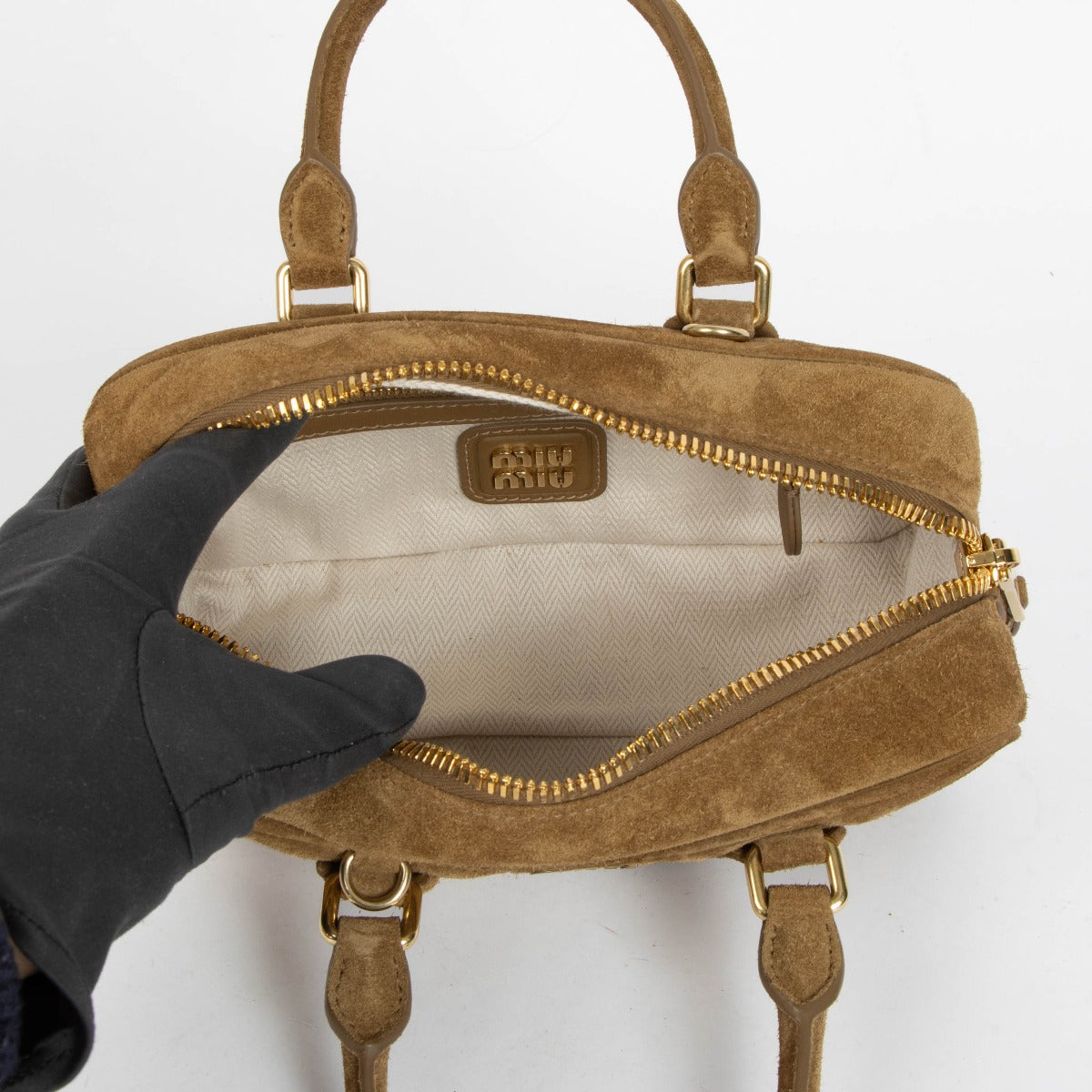 Authentic pre-loved Miu Miu Brown Suede Arcadie Top Handle Bag on Labellov.com