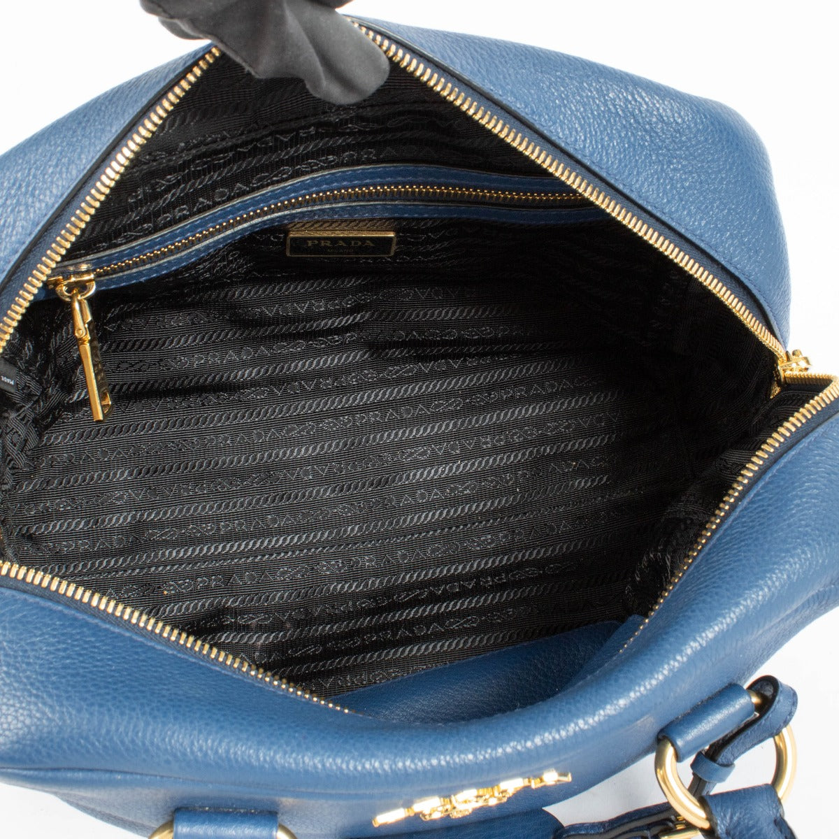 Authentic pre-loved Prada Blue Mini Vitello Phenix Bauletto Bag on Labellov.com
