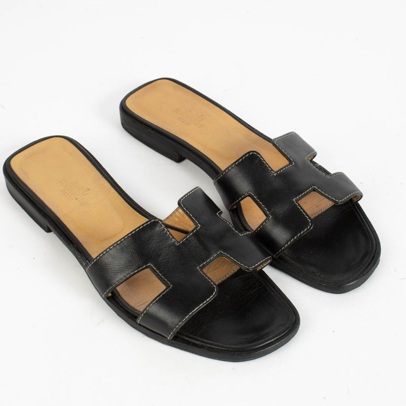 Authentic pre-loved Hermès Black Calfskin Oran Sandals - Size 37.5 on Labellov.com