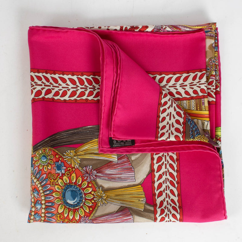 Are you looking for an authentic designer accessory? We buy and sell your preloved and brand new Hermès Pink Silk La Danse Du Cheval Marwari Carré 90 Scarf.