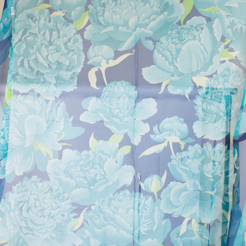 Are you looking for an authentic designer accessory? We buy and sell your preloved and brand new Hermès Blue Silk Mousseline Les Pivoines 140 Shawl.