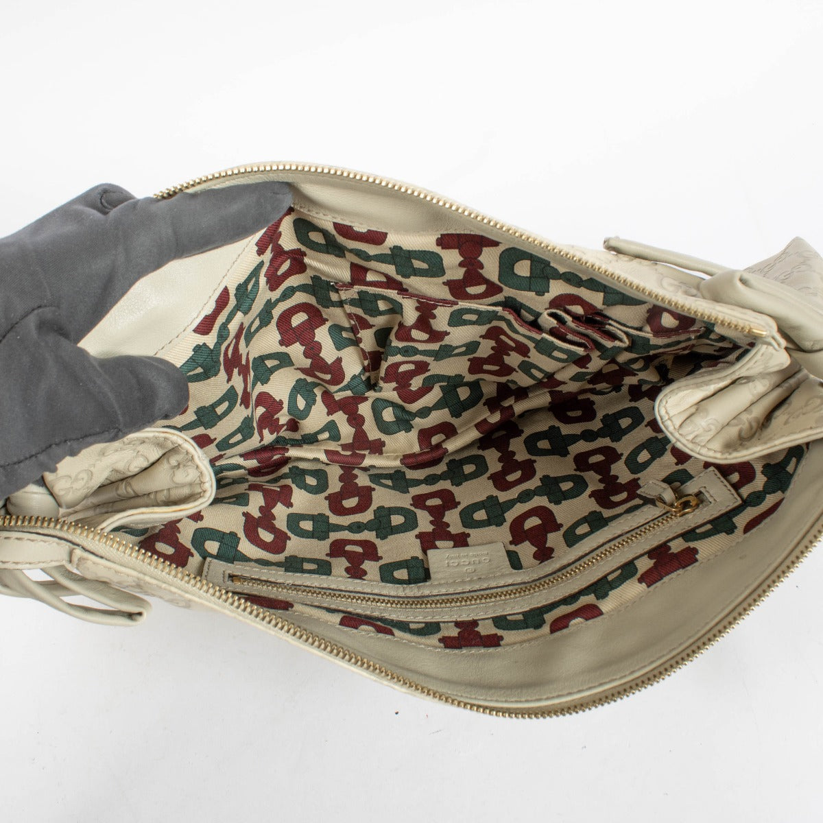 Authentic pre-loved Gucci Beige Leather Guccissima Large Hysteria Clutch on Labellov.com