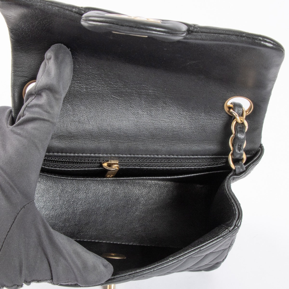 Shop this authentic Chanel Black Lambskin Mini Square Classic Flap Bag pre-loved on Labellov.com