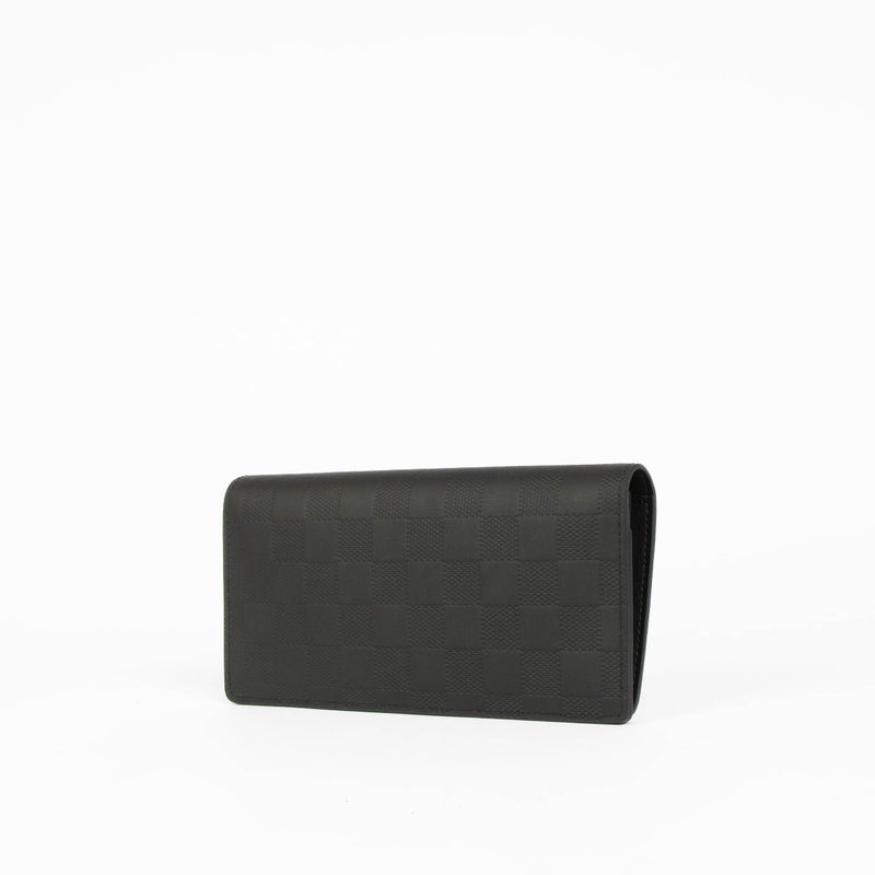 Shop this 100% authentic Louis Vuitton Black Damier Infini Brazza Wallet at Labellov.com