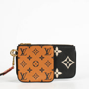 Authentic pre-loved Louis Vuitton Black Monogram Empreinte Crafty Pochette Duo Wallet on Labellov.com