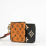 Authentic pre-loved Louis Vuitton Black Monogram Empreinte Crafty Pochette Duo Wallet on Labellov.com