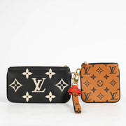 Authentic pre-loved Louis Vuitton Black Monogram Empreinte Crafty Pochette Duo Wallet on Labellov.com