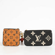 Authentic pre-loved Louis Vuitton Black Monogram Empreinte Crafty Pochette Duo Wallet on Labellov.com