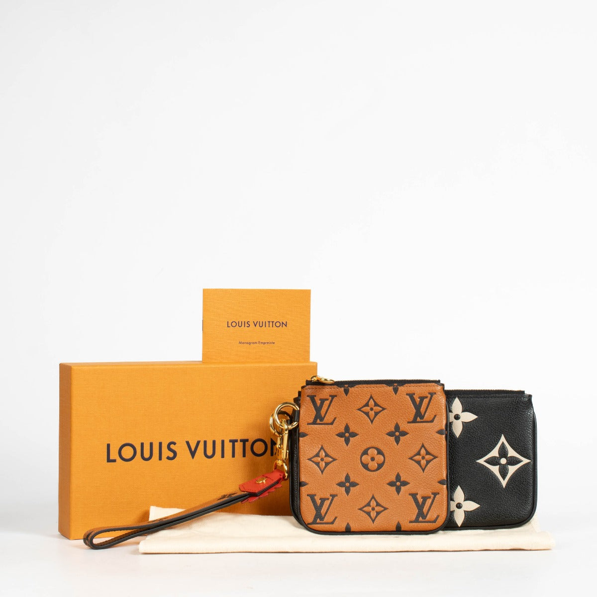 Authentic pre-loved Louis Vuitton Black Monogram Empreinte Crafty Pochette Duo Wallet on Labellov.com