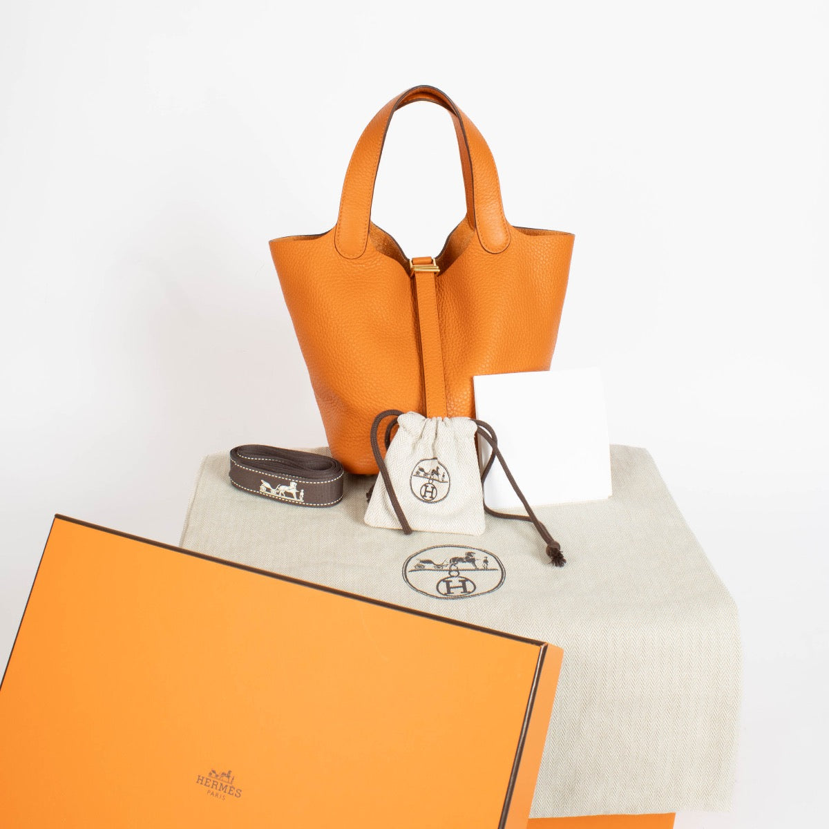 authentic preloved Hermès Picotin Lock 18 Orange Clemence GHW on Labellov.com