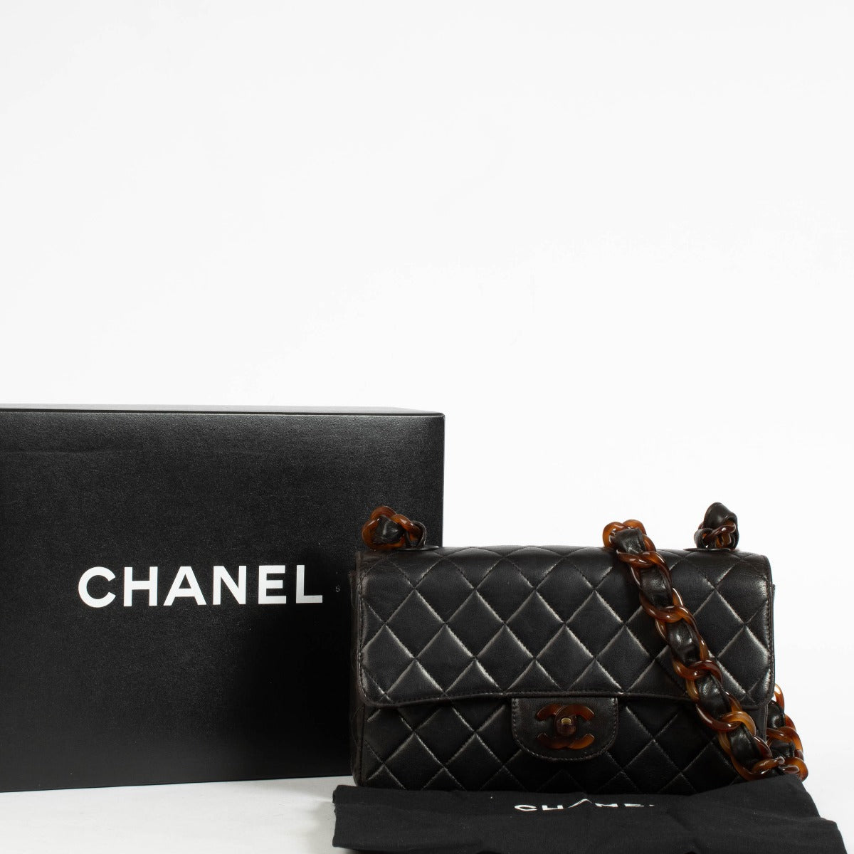 Authentic pre-loved Chanel Black Tortoiseshell Small Classic Flap Bag on Labellov.com