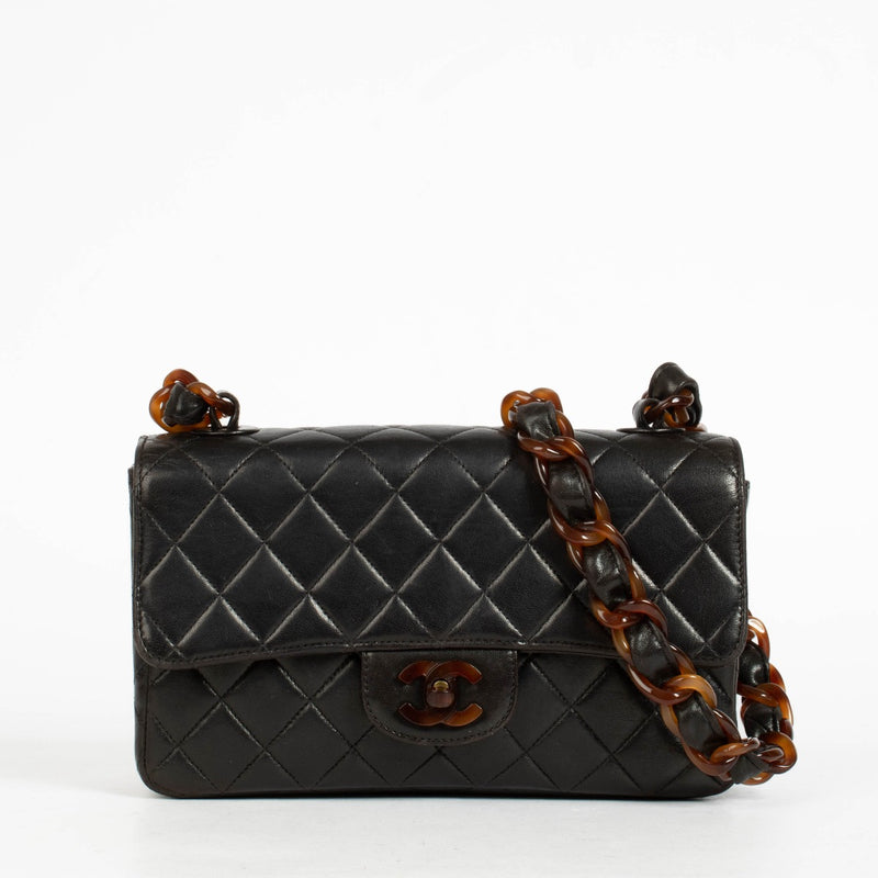 Authentic pre-loved Chanel Black Tortoiseshell Small Classic Flap Bag on Labellov.com