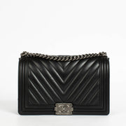 Authentic pre-loved Chanel Black Chevron Calfskin Large Boy Chanel Bag on Labellov.com