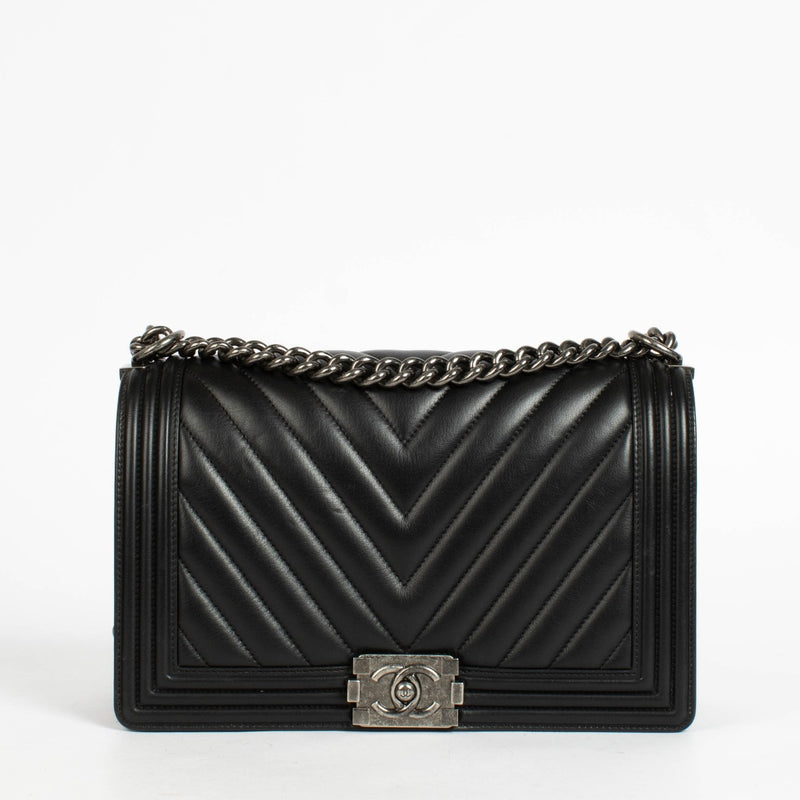 Authentic pre-loved Chanel Black Chevron Calfskin Large Boy Chanel Bag on Labellov.com
