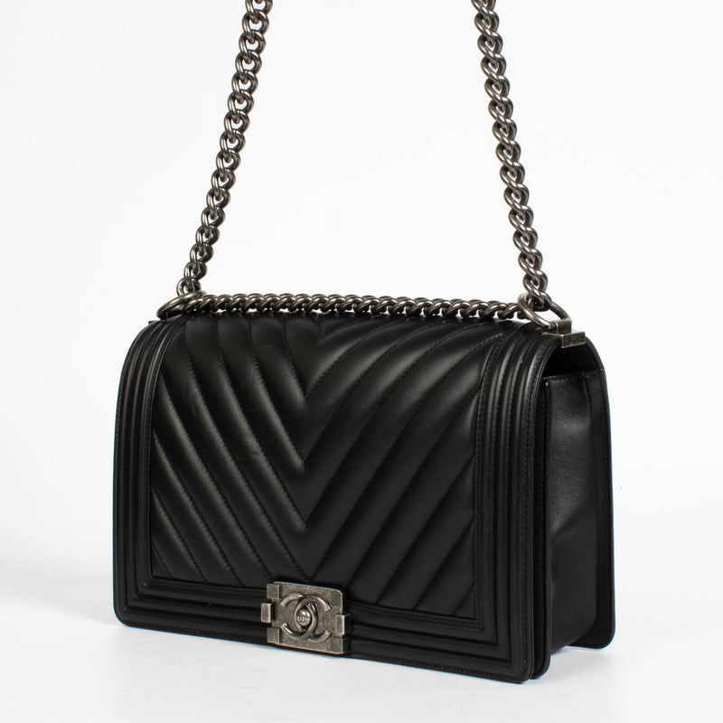 Authentic pre-loved Chanel Black Chevron Calfskin Large Boy Chanel Bag on Labellov.com