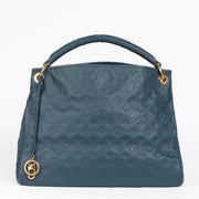Authentic pre-loved Louis Vuitton Blue Monogram Empreinte Artsy MM Shoulder Bag on Labellov.com