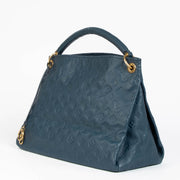 Authentic pre-loved Louis Vuitton Blue Monogram Empreinte Artsy MM Shoulder Bag on Labellov.com