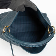 Authentic pre-loved Louis Vuitton Blue Monogram Empreinte Artsy MM Shoulder Bag on Labellov.com