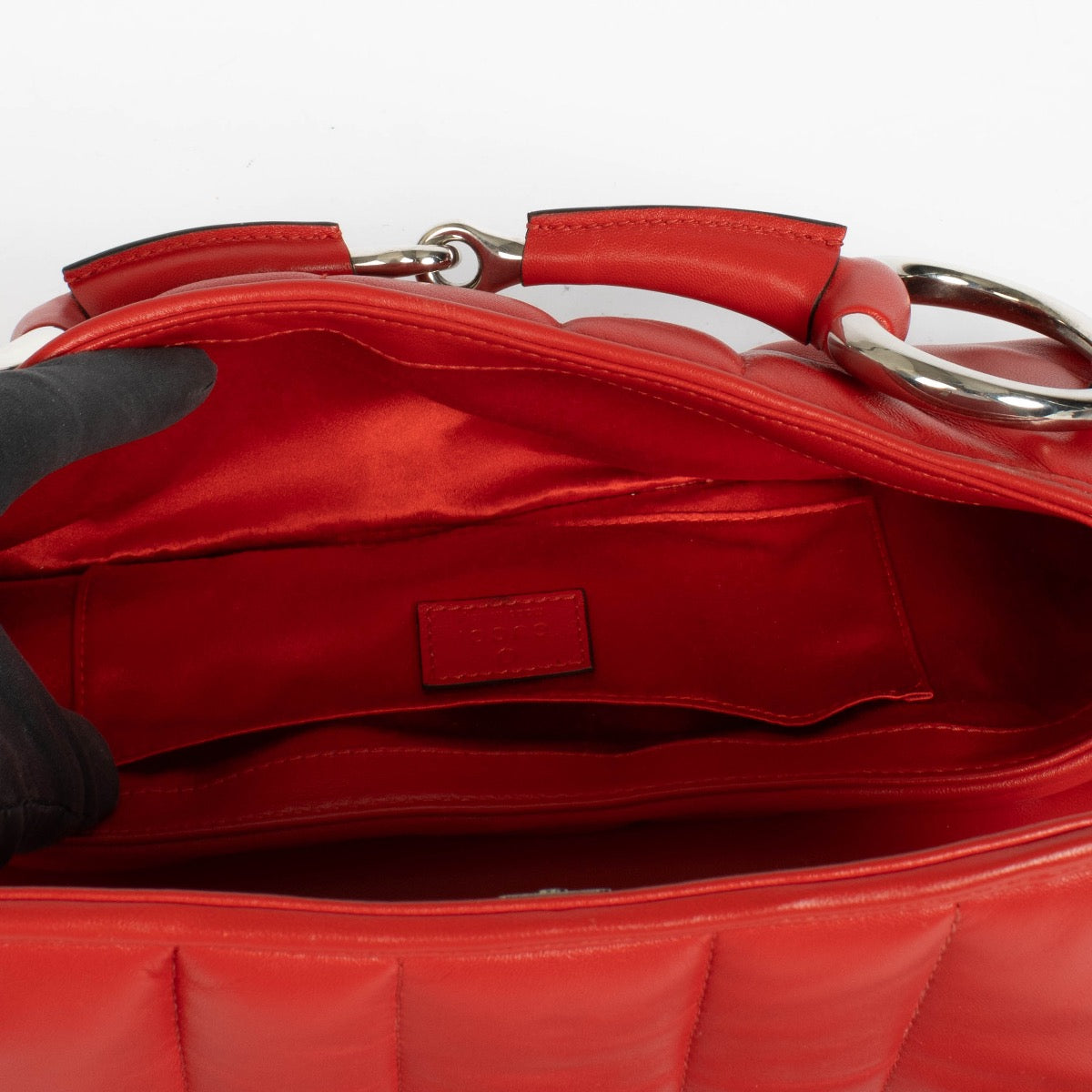 Authentic pre-loved Gucci Red Leather Medium Horsebit Chain Clutch on Labellov.com