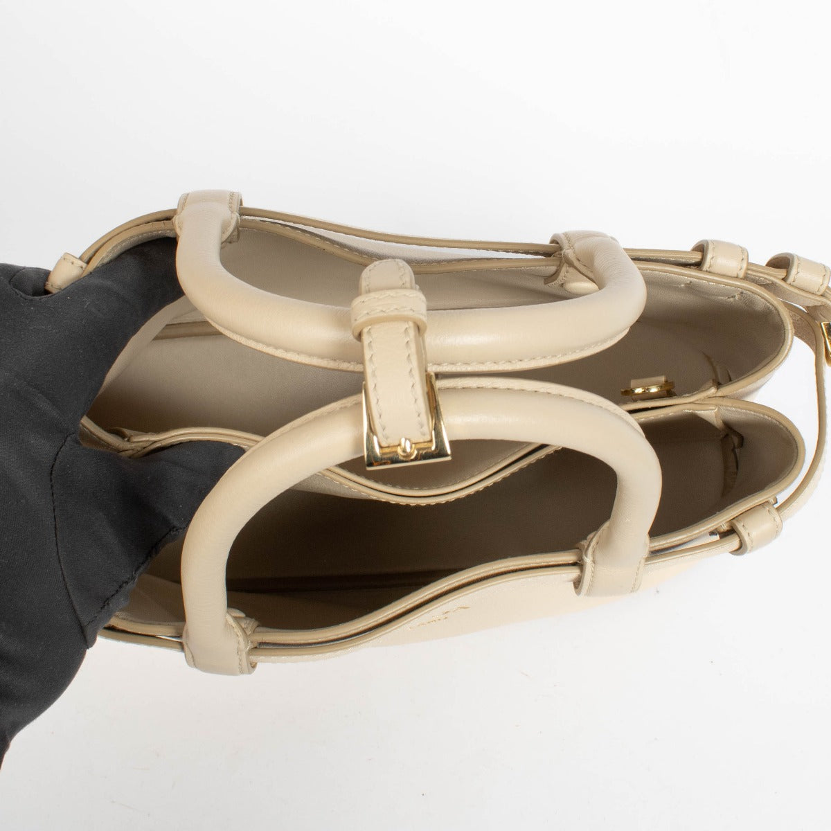 Authentic pre-loved Prada Travetine Leather Small Buckle Double Belt Bag on Labellov.com
