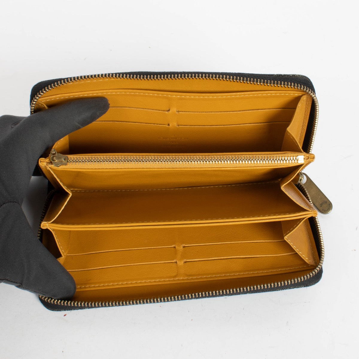 Authentic pre-loved Louis Vuitton Black Monogram Denim Zippy Wallet on Labellov.com