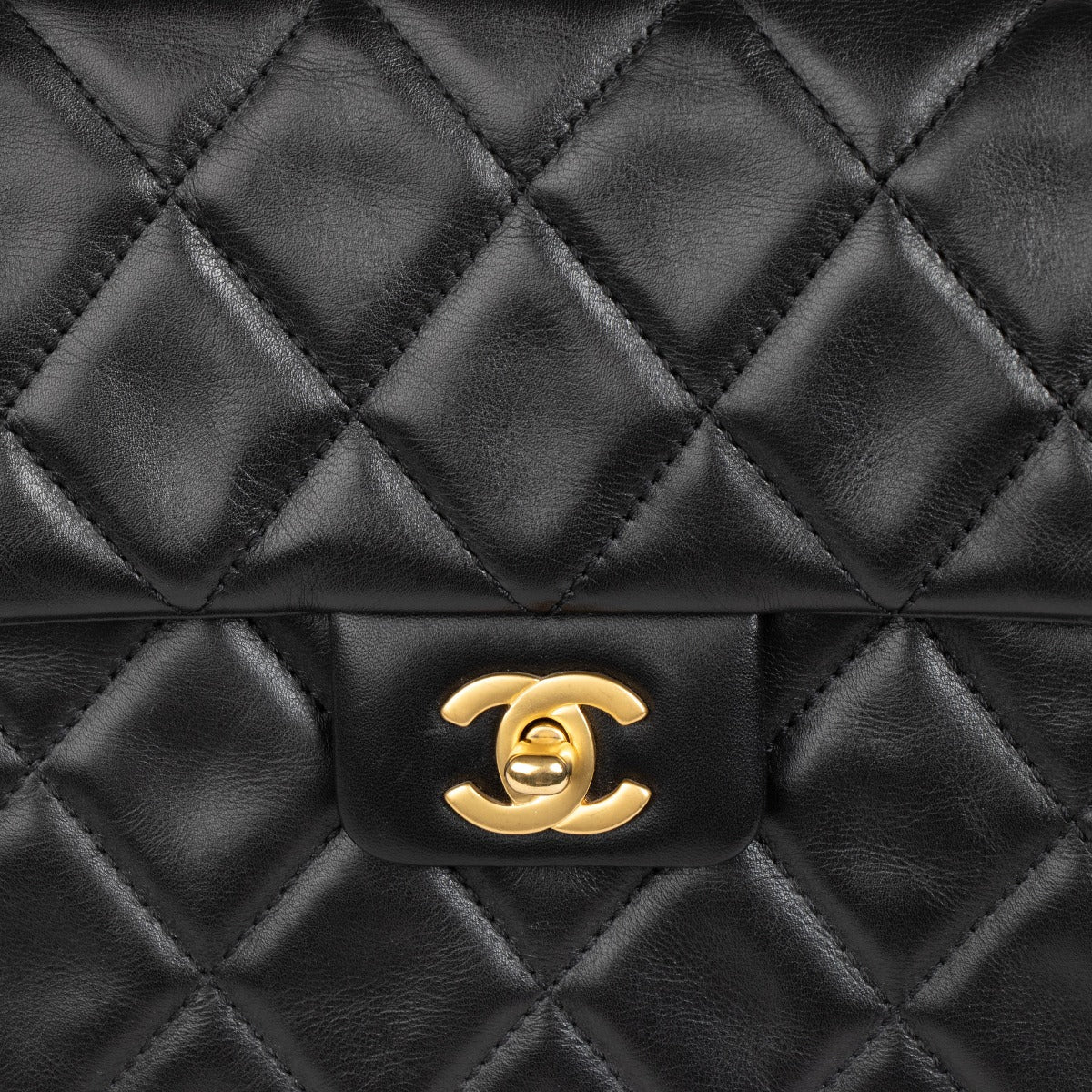 Authentic pre-loved Chanel Black Quilted Lambskin Large Vintage Flap Bag on Labellov.com