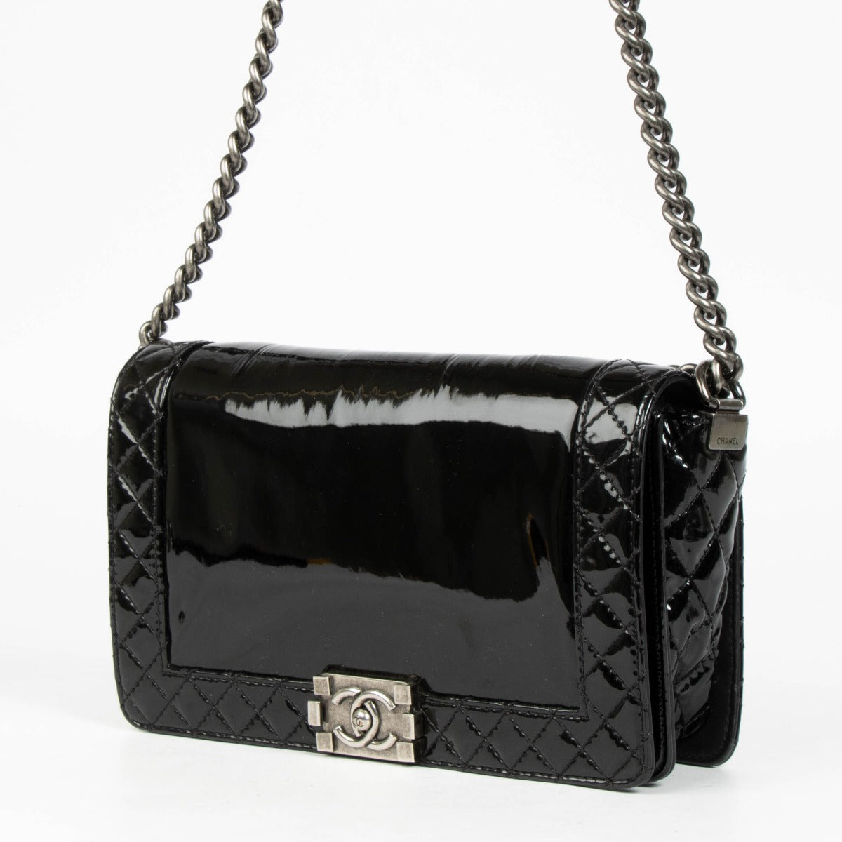 Authentic pre-loved Chanel Black Patent Leather Large Boy Chanel Bag on Labellov.com