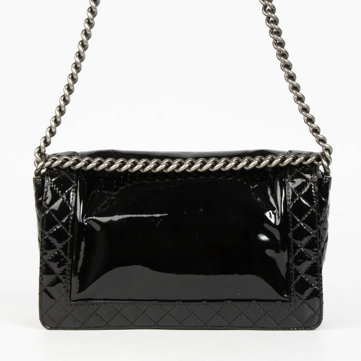 Authentic pre-loved Chanel Black Patent Leather Large Boy Chanel Bag on Labellov.com