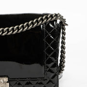Authentic pre-loved Chanel Black Patent Leather Large Boy Chanel Bag on Labellov.com