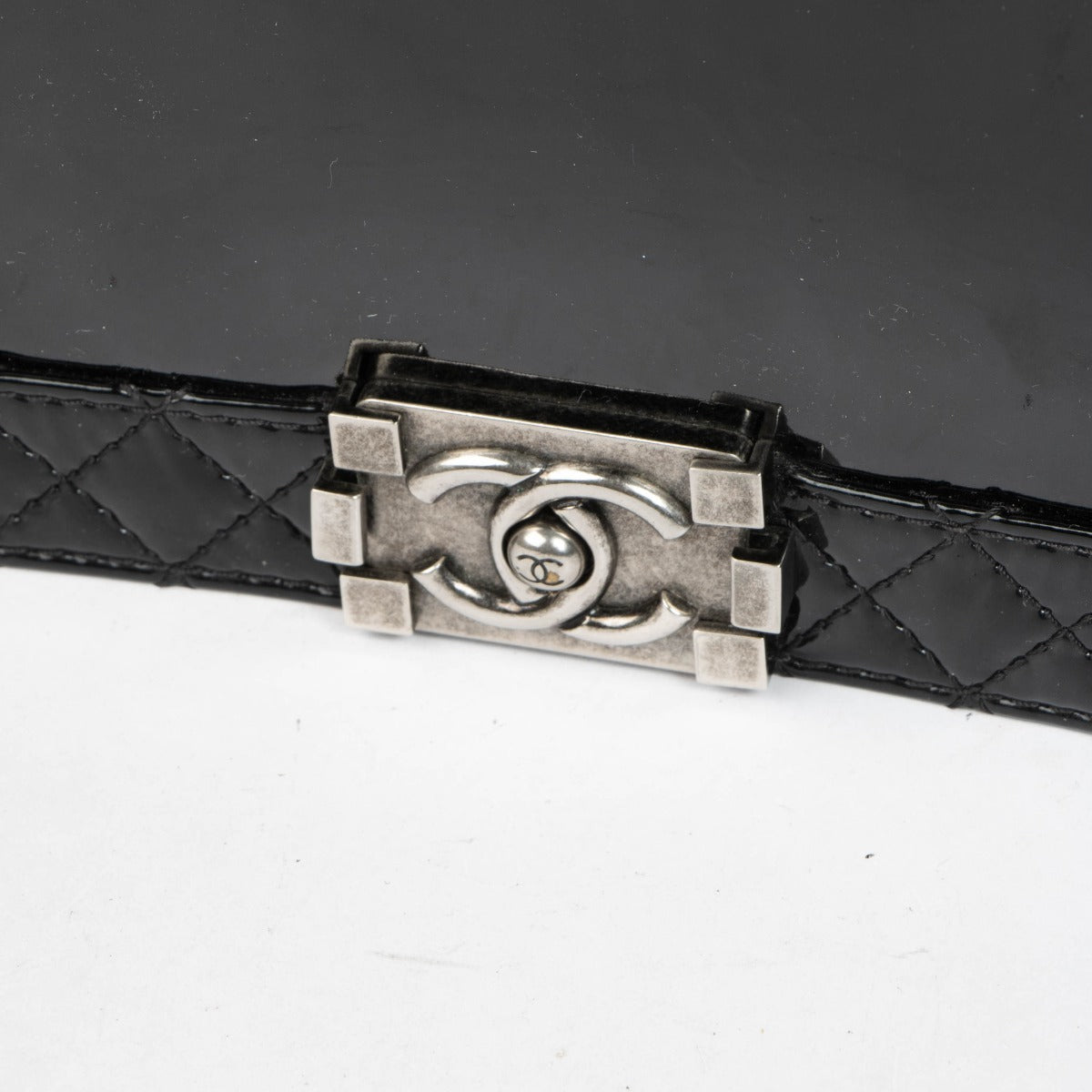 Authentic pre-loved Chanel Black Patent Leather Large Boy Chanel Bag on Labellov.com