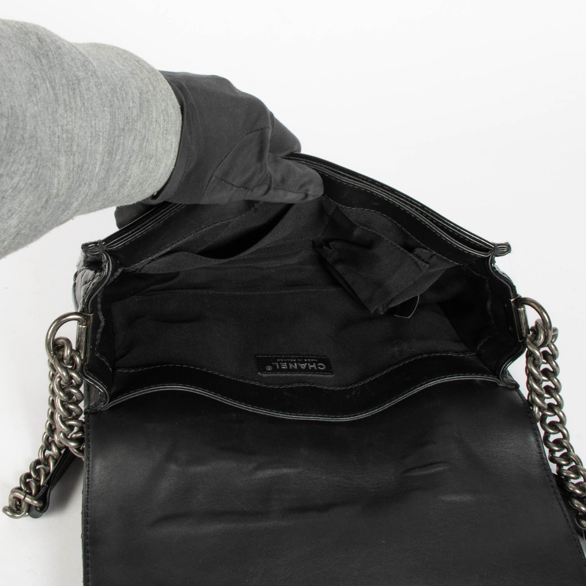 Authentic pre-loved Chanel Black Patent Leather Large Boy Chanel Bag on Labellov.com