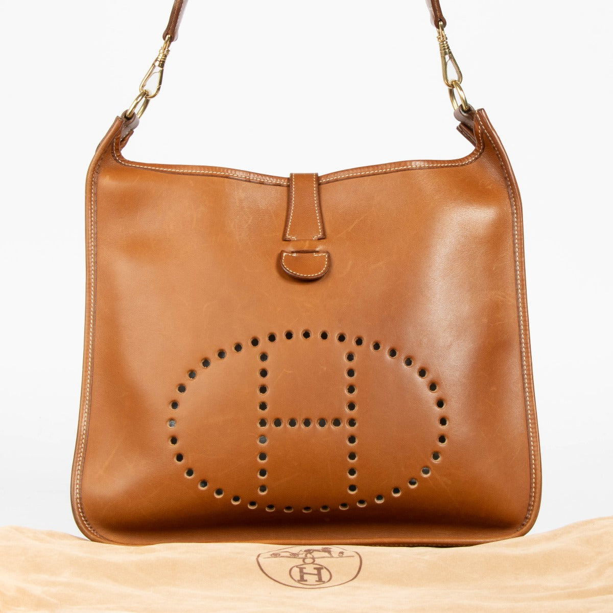 Shop this authentic Hermès Evelyne 33 Fauve Barenia GHW Crossbody pre-loved on Labellov.com
