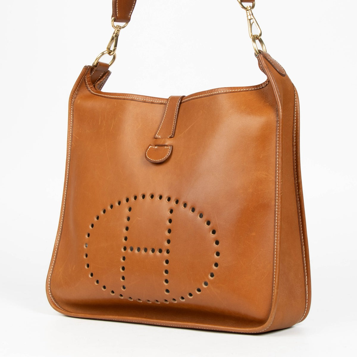 Shop this authentic Hermès Evelyne 33 Fauve Barenia GHW Crossbody pre-loved on Labellov.com