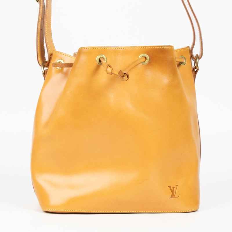 100% authentic second hand Louis Vuitton Nomade Leather Noé Bag with drawstring closure and adjustable shoulder strap.