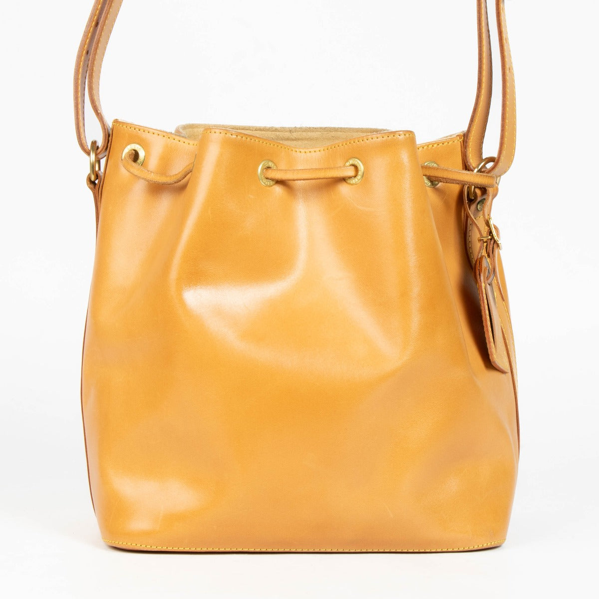 100% authentic second hand Louis Vuitton Nomade Leather Noé Bag with drawstring closure and adjustable shoulder strap.
