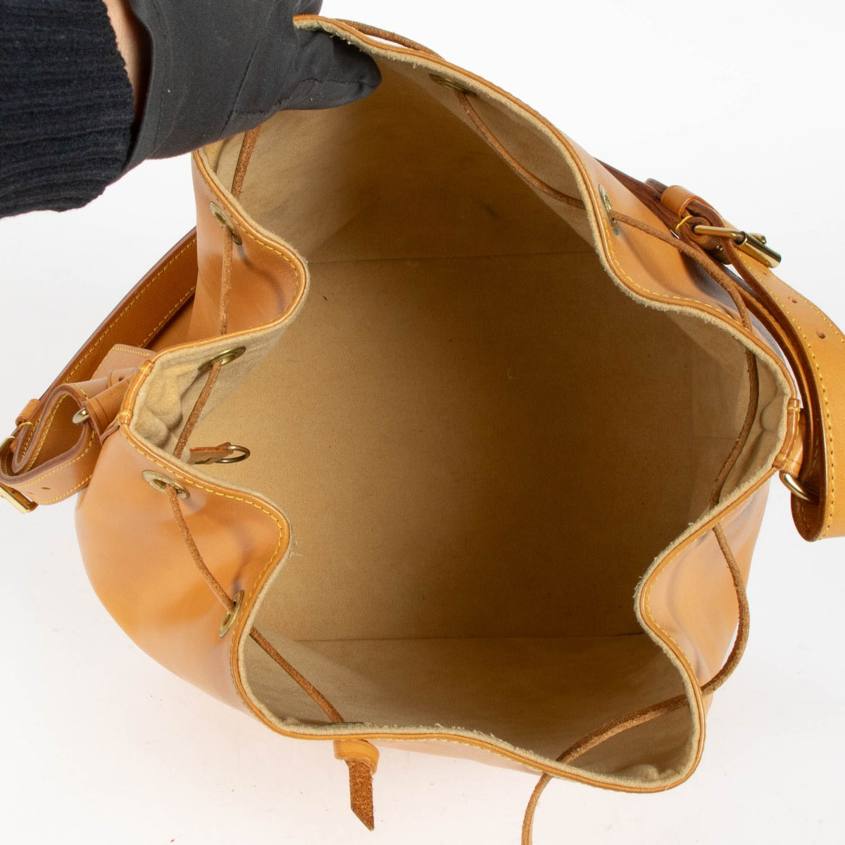 100% authentic second hand Louis Vuitton Nomade Leather Noé Bag with drawstring closure and adjustable shoulder strap.