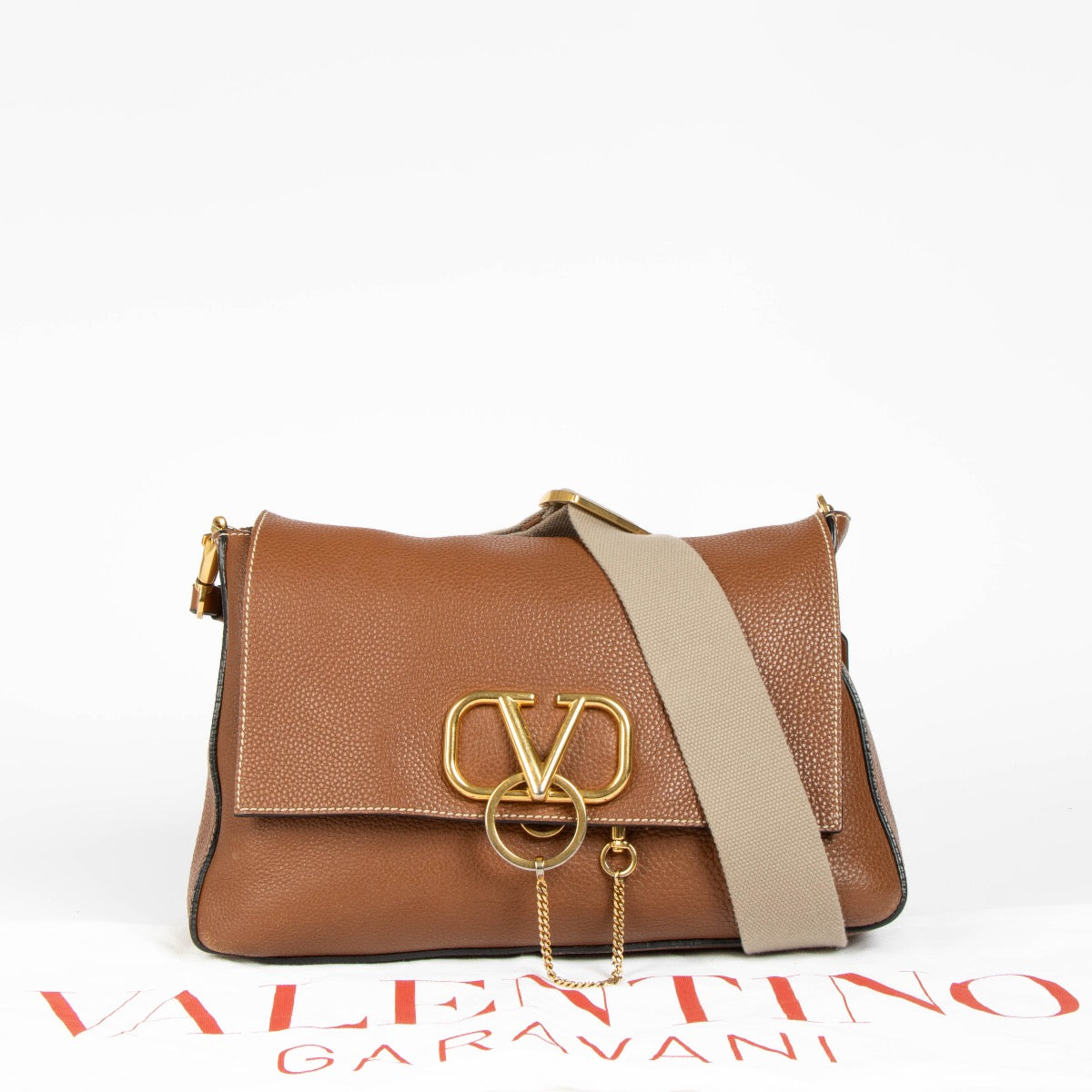 Authentic pre-loved Valentino Garavani Vring Cognac Crossbody Bag on Labellov.com