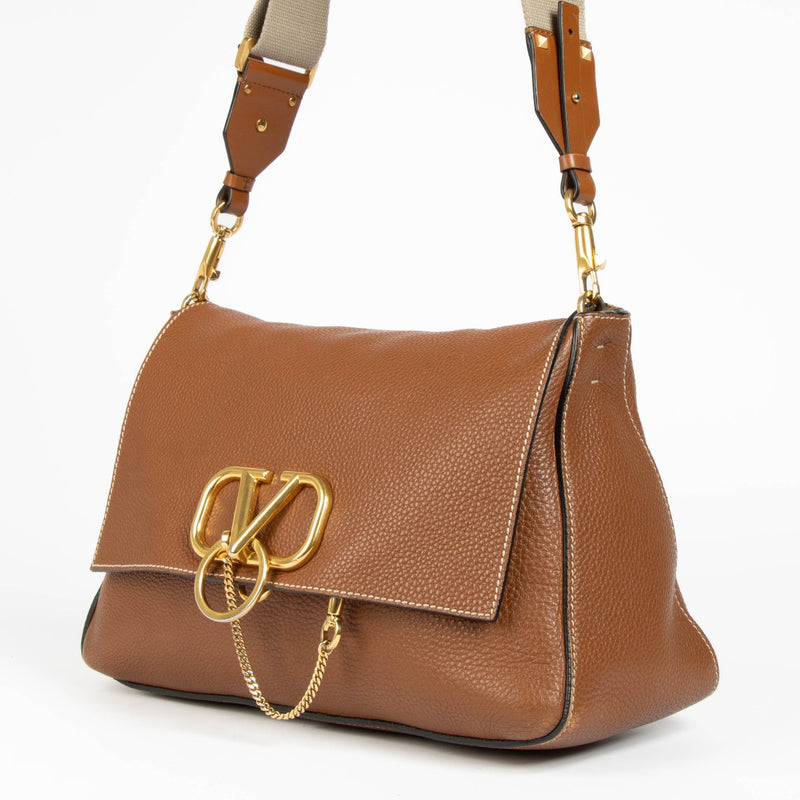 Authentic pre-loved Valentino Garavani Vring Cognac Crossbody Bag on Labellov.com
