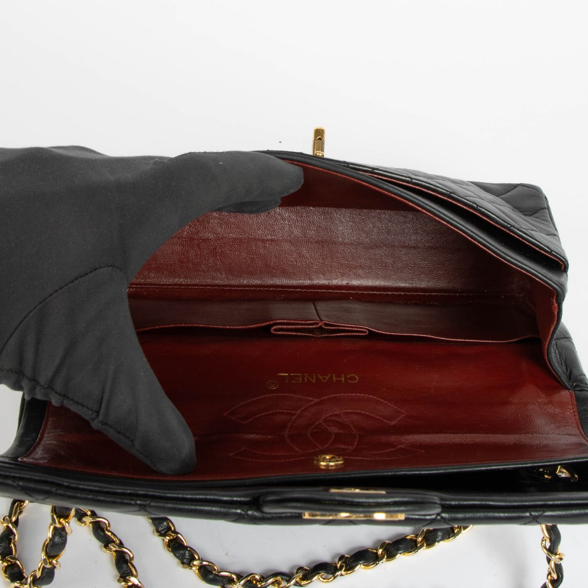 Shop this authentic Chanel 1980s Black Medium Classic Flap Bag pre-loved on Labellov.com
