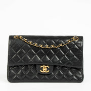 Shop this authentic Chanel 1980s Black Medium Classic Flap Bag pre-loved on Labellov.com