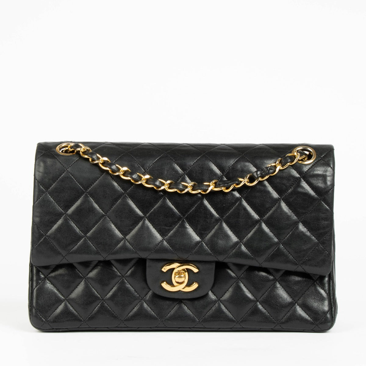 Shop this authentic Chanel 1980s Black Medium Classic Flap Bag pre-loved on Labellov.com