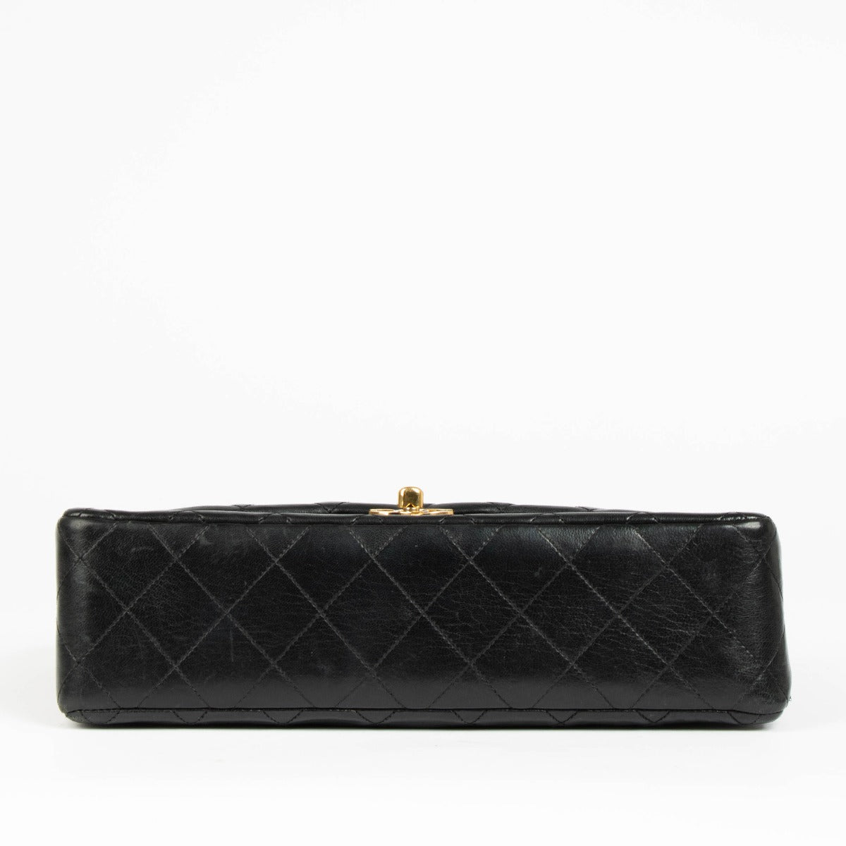 Shop this authentic Chanel 1980s Black Medium Classic Flap Bag pre-loved on Labellov.com
