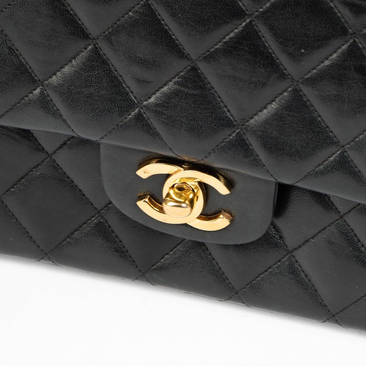 Shop this authentic Chanel 1980s Black Medium Classic Flap Bag pre-loved on Labellov.com