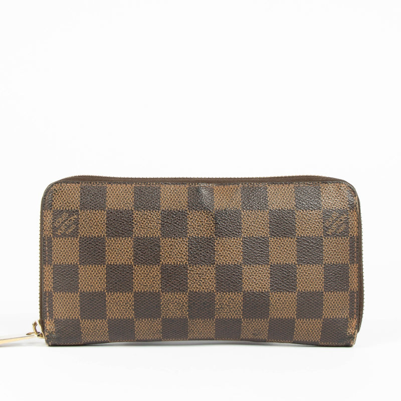 Shop this authentic Louis Vuitton Damier Ebene Zippy Wallet pre-loved on Labellov.com