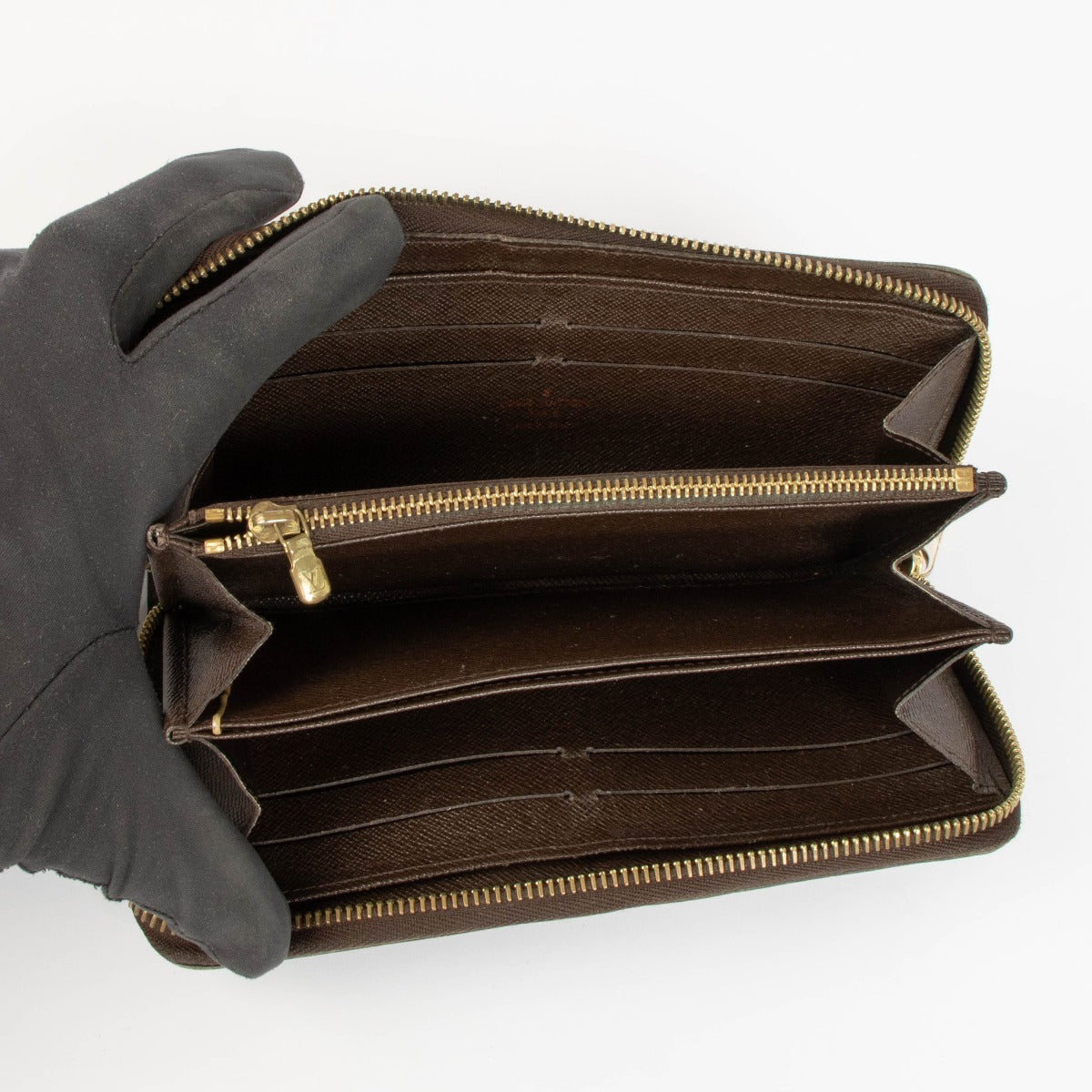 Shop this authentic Louis Vuitton Damier Ebene Zippy Wallet pre-loved on Labellov.com