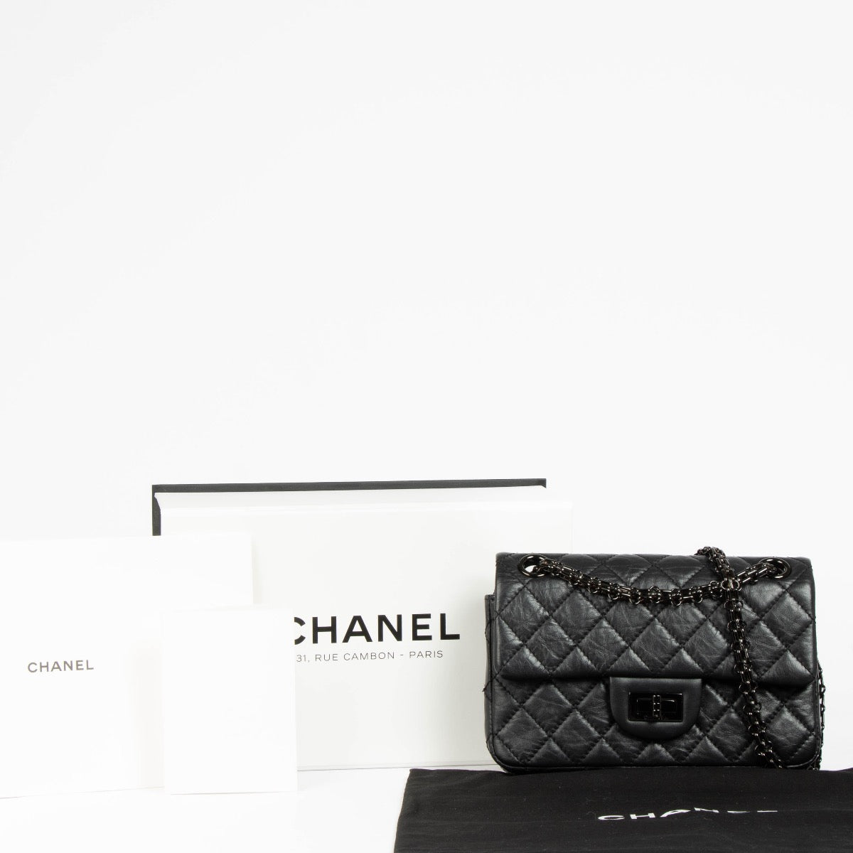 Authentic pre-loved Chanel So Black Calfskin Mini 2.55 Reissue Bag on Labellov.com